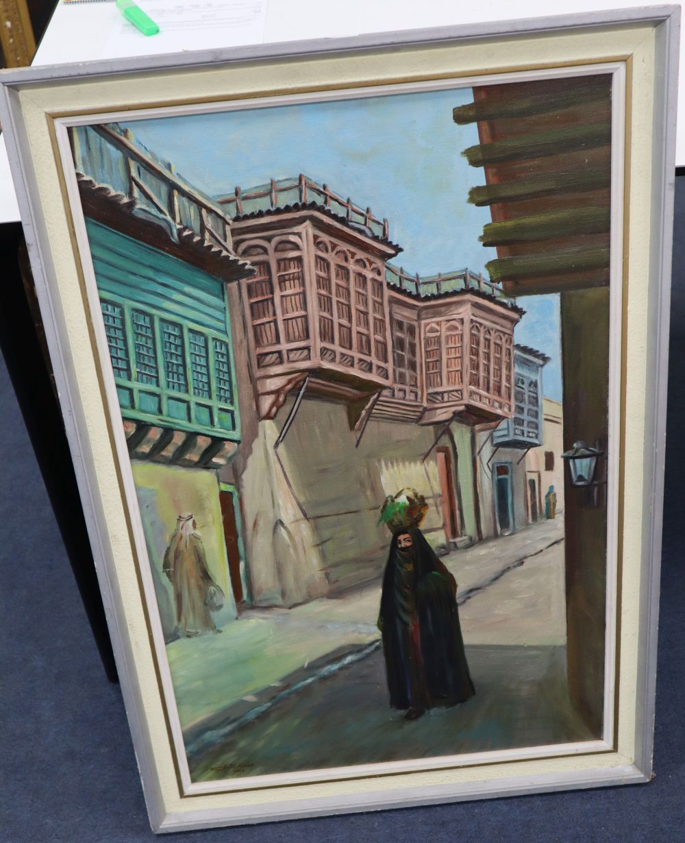 North African School, oil on board, Arab street scene, signed and dated 1977, 80 x 52cm